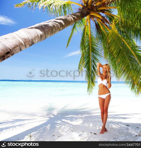 woman under palm sea on backgroud