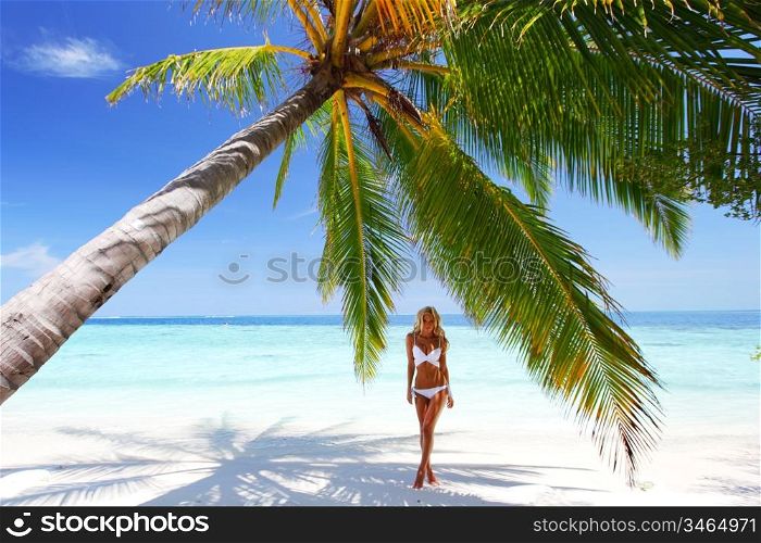 woman under palm sea on backgroud