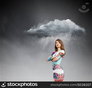 Woman under rain. Young pretty woman standing under raining cloud