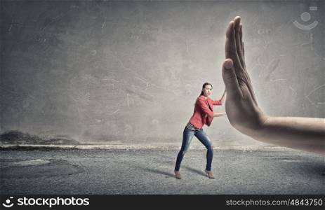 Woman undergo authority power. Small woman under pressure of big human hand