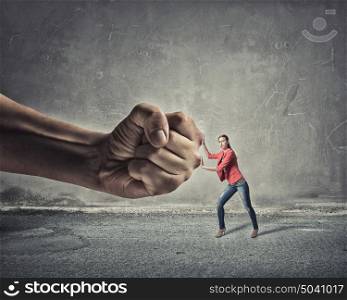 Woman undergo authority power. Small woman under pressure of big human hand