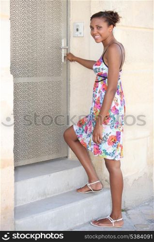 Woman unlocking her front door
