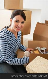 Woman Unpacking Moving Box