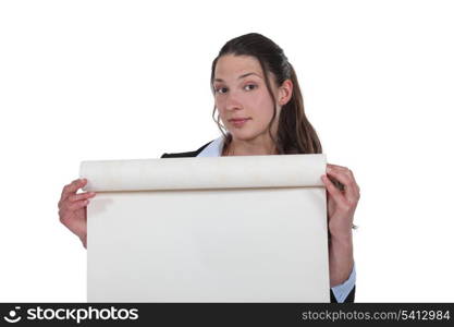 Woman unrolling a roll of paper