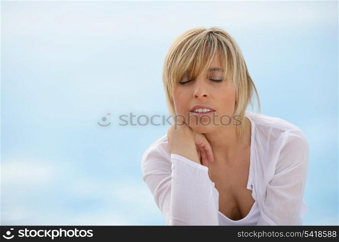 Woman unwinding alone at the seaside