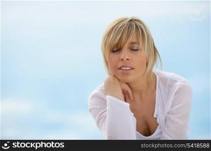 Woman unwinding alone at the seaside