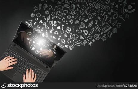 Woman use laptop. Top view of businesswoman hands using black laptop