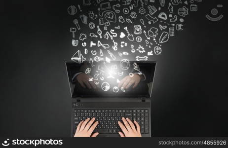 Woman use laptop. Top view of businesswoman hands using black laptop