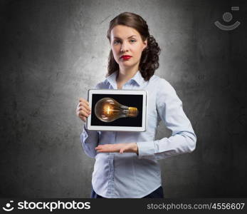 Woman use tablet device. Confident young businesswoman working on digital tablet pc