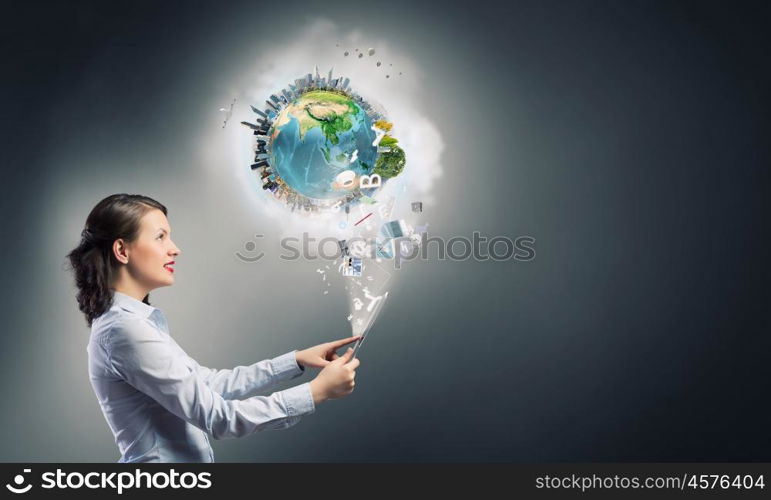 Woman use tablet device. Confident young businesswoman working on digital tablet pc. Elements of this image are furnished by NASA