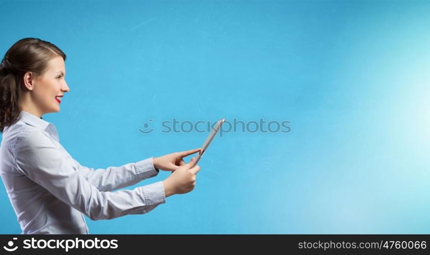 Woman use tablet device. Confident young businesswoman working on digital tablet pc