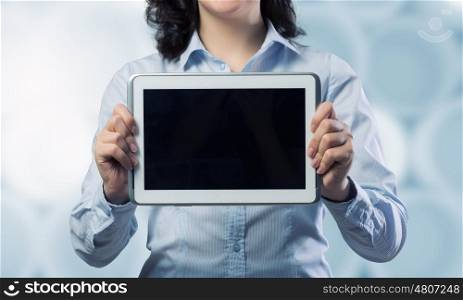 Woman use tablet device. Confident young businesswoman working on digital tablet pc