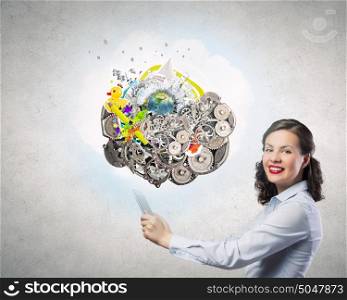 Woman use tablet device. Confident young businesswoman working on digital tablet pc. Elements of this image are furnished by NASA