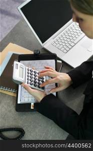 Woman using a calculator
