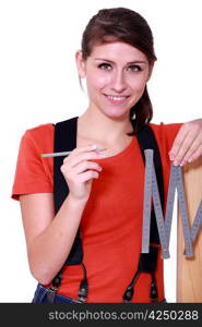 Woman using a carpenter&acute;s ruler