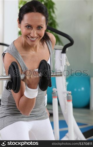 Woman using a dumbbell