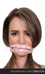 Woman using a tailors measuring tape for a unique diet plan