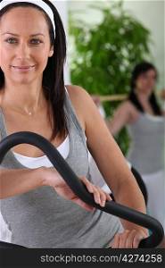 Woman using an exercise machine