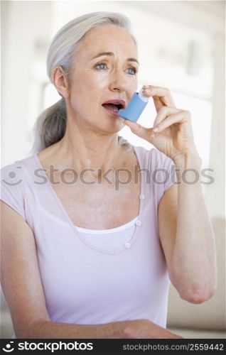 Woman Using An Inhaler