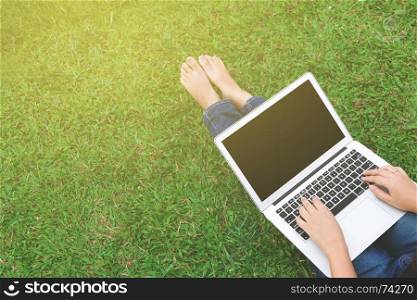 woman using blank screen laptop at a outdoors