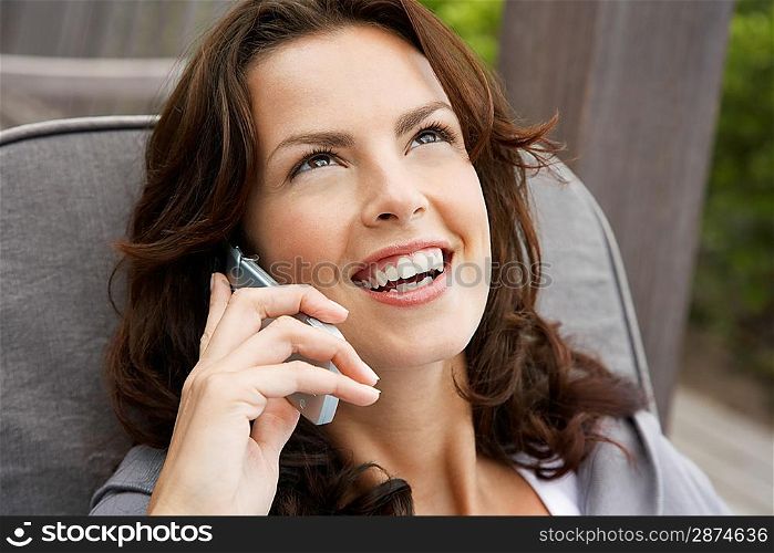 Woman using cell phone head and shoulders