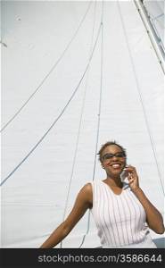 Woman Using Cell Phone on Yacht