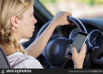 woman using cellphone while driving