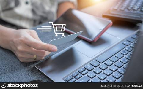 Woman using credit card filling billing information on laptop computer shopping in ecommerce store. concept : online payment, accessible internet money transaction