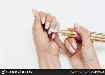 woman using digital nail file