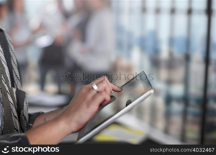 Woman using digital tablet