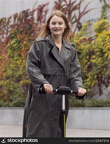 woman using electric scooter outside