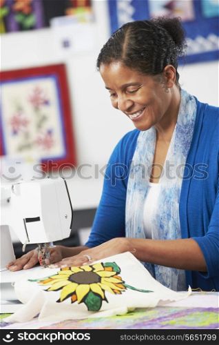 Woman Using Electric Sewing Machine