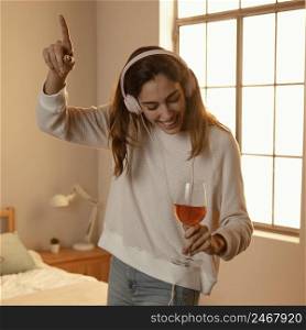 woman using headphones music home drinking