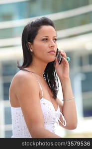 Woman using her cellphone in a city