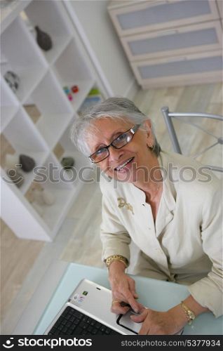 Woman using her laptop at home