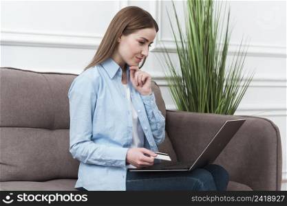 woman using her laptop buy online products