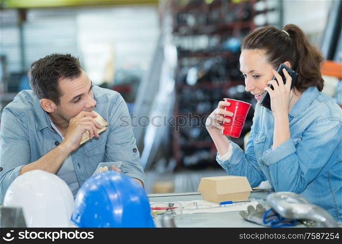 woman using her phone during lunch break