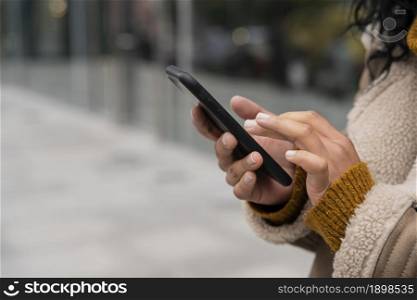 woman using her smartphone outside with copy space. Resolution and high quality beautiful photo. woman using her smartphone outside with copy space. High quality beautiful photo concept