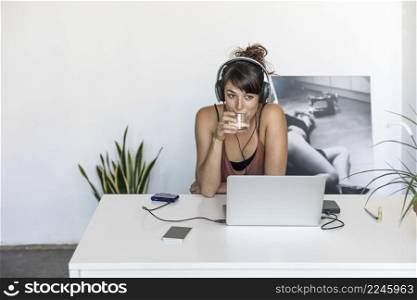 Woman using laptop and working from home. Isabella Antonelli