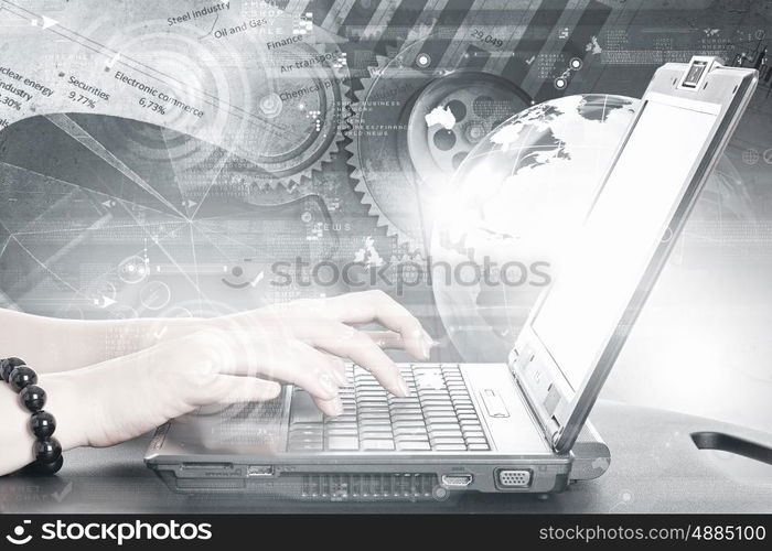 Woman using laptop. Close up of female hands typing on laptop keyboard