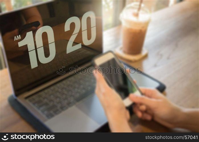 Woman using laptop in the coffee shop, stock photo