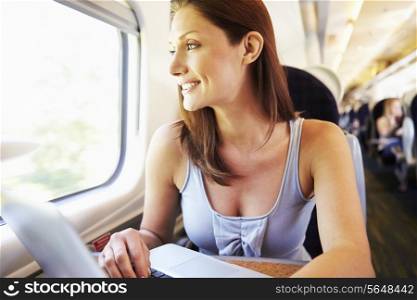 Woman Using Laptop On Train