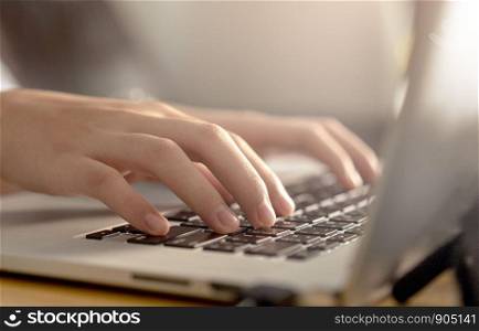 woman using laptop, searching web, browsing information, Close up of business women working with typing on laptop empty at workplace.Selective focus