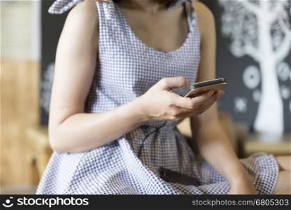woman using mobile phone in cafe coffee shop