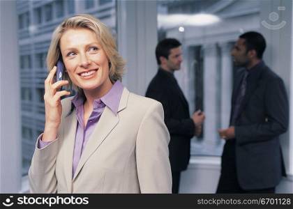 woman using mobile phone in office