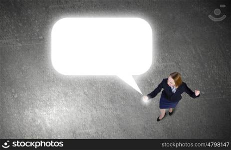 Woman using mobile phone. Top view of businesswoman with mobile phone in hand