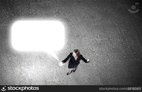Woman using mobile phone. Top view of businesswoman with mobile phone in hand