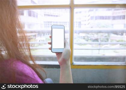 Woman using mobile smart phone, sending massages Phone with white screen video calls, holidays work using internetTravel preparations concept