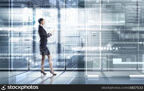 Woman using modern technologies. Businesswoman with mobile phone against high tech background
