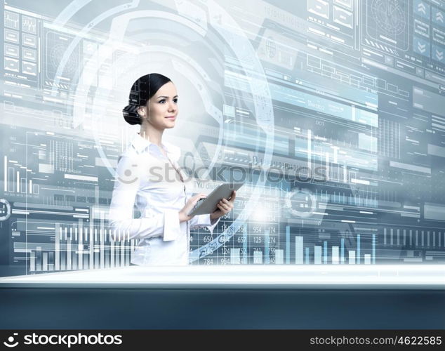 Woman using modern technologies. Businesswoman with tablet pc against high tech blue background